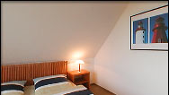 Schlafzimmer im DG der Doppelhaush&auml;lfte "Delft"